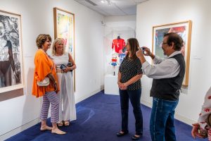 artist michelle smythe takes a photo with visitors